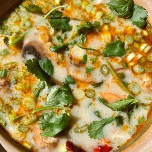 Close up of tom kha soup cooked in a campervan