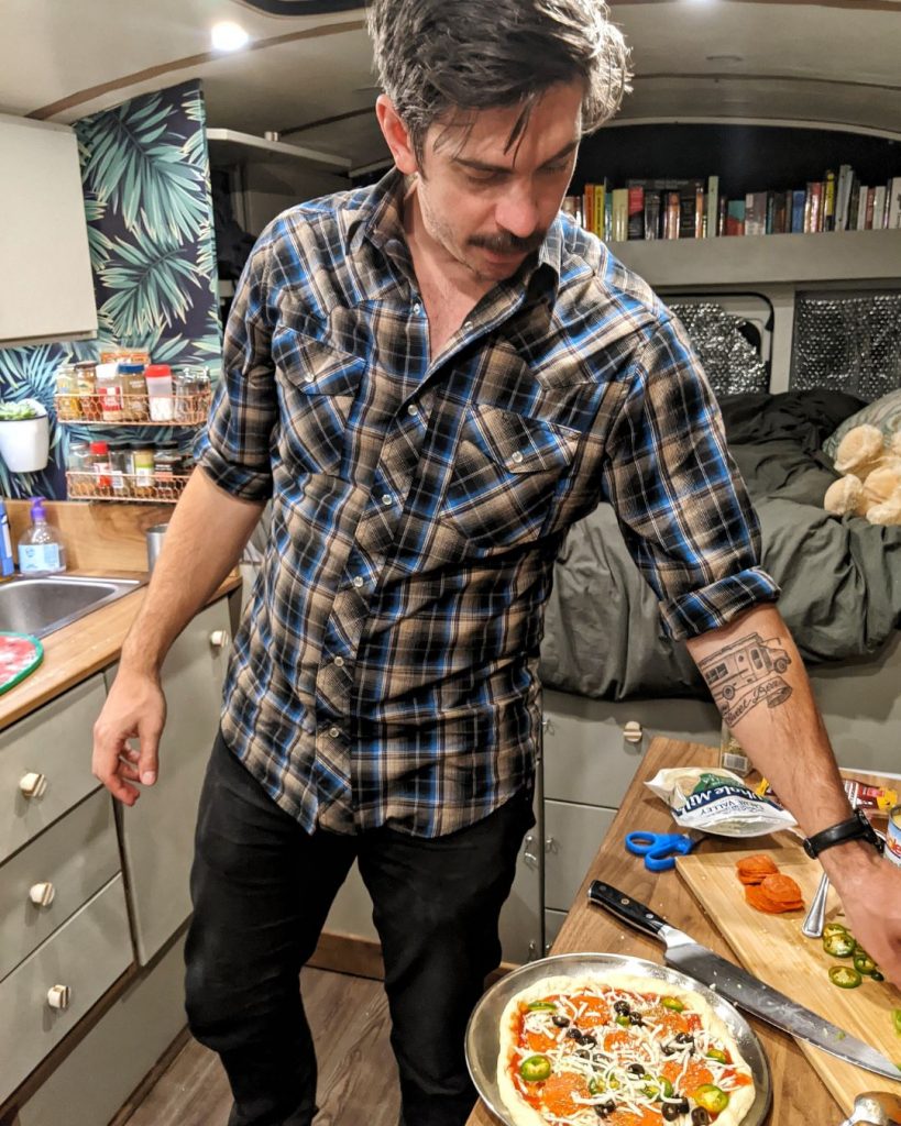 Andy making pizza in the bus