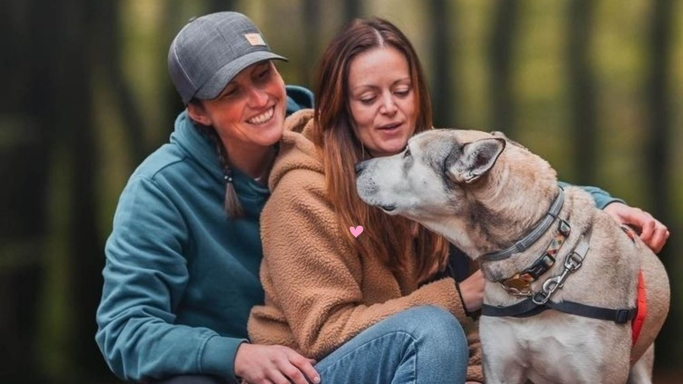 Emily and Louise of Camper vibe kneeling down with their dog AJ
